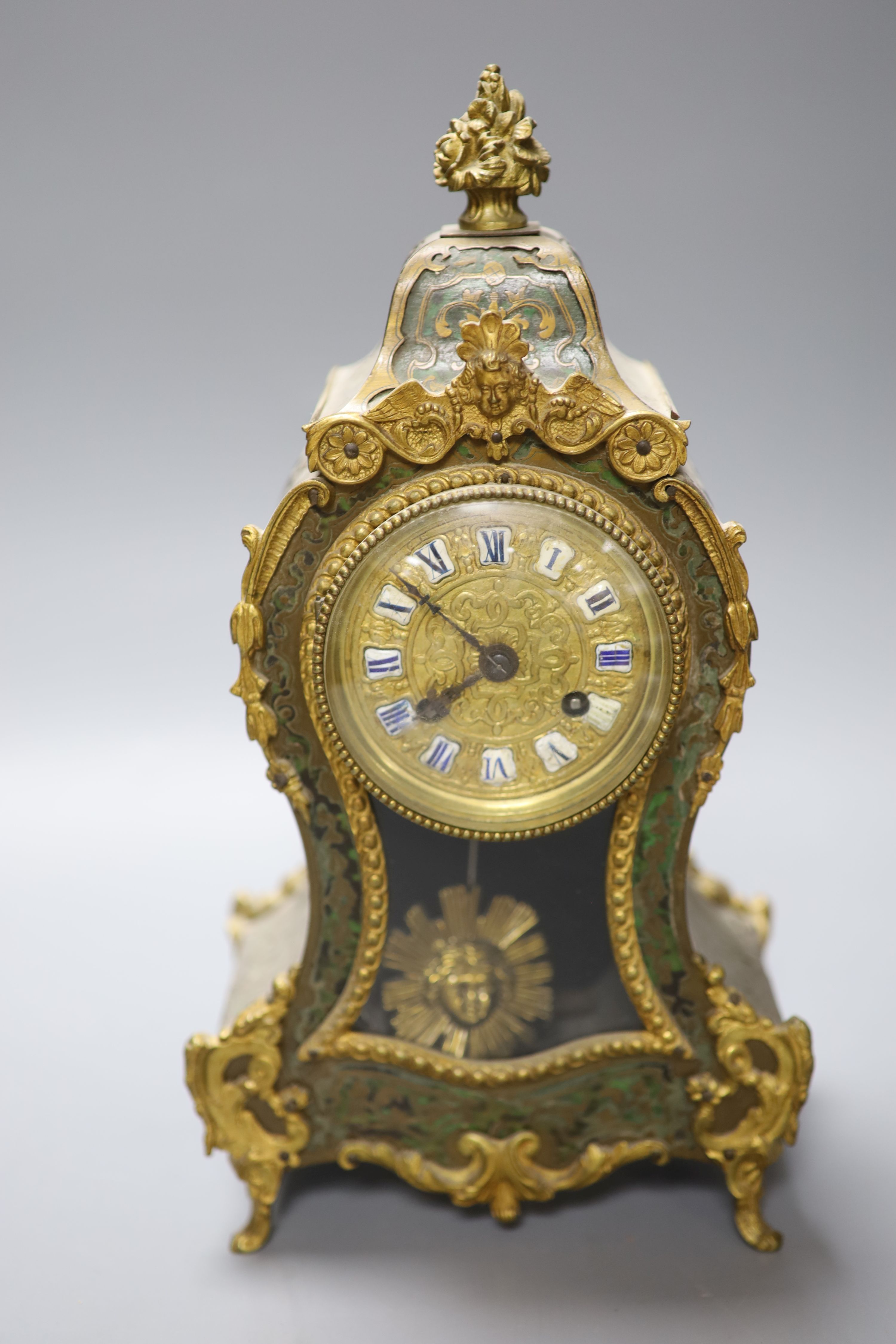 A 19th century French green boulle mantel clock, height 30cm